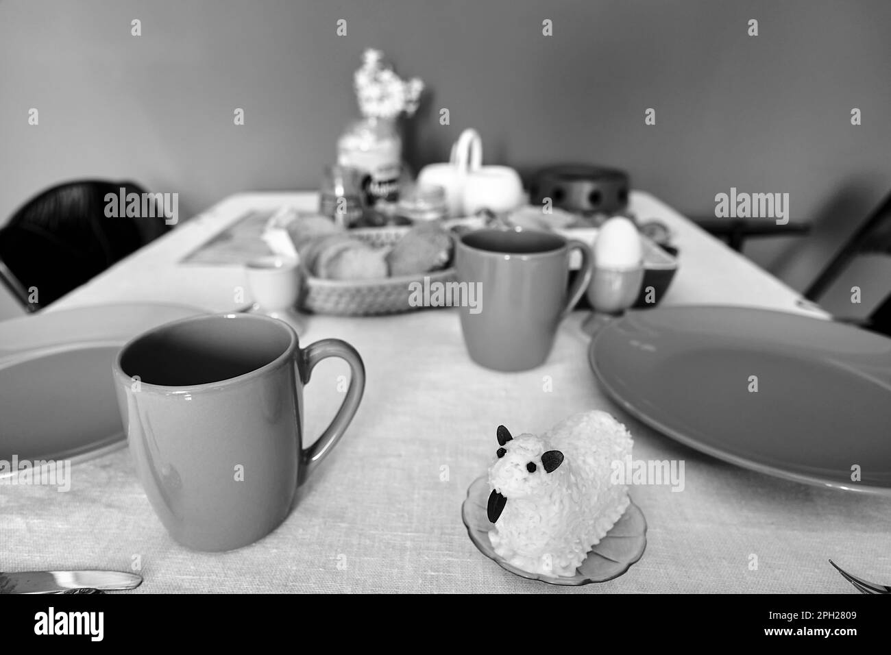 set table with Easter butter lamb prepared for Easter breakfast in Poland, monochrome Stock Photo