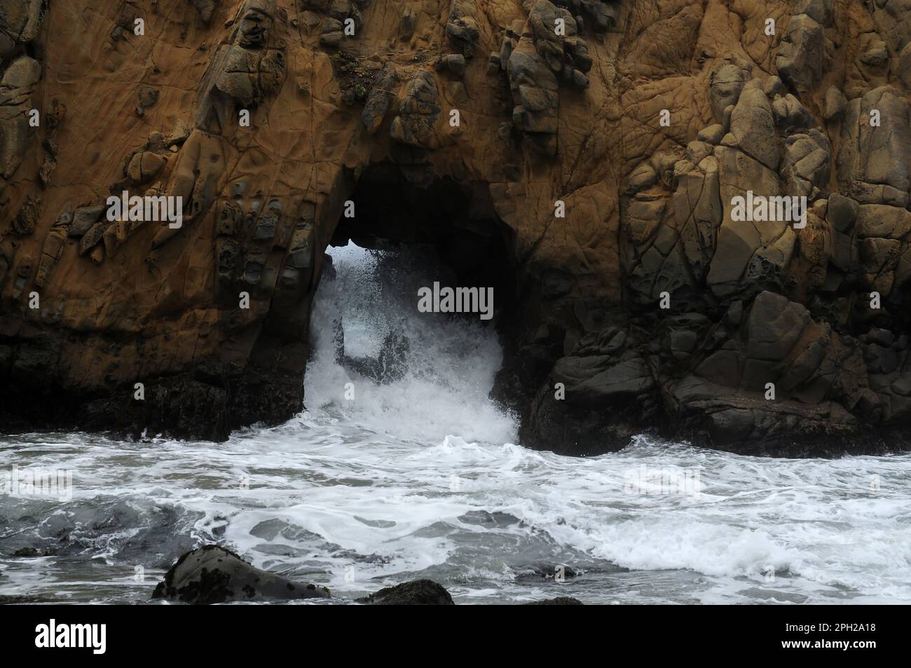 Hole through stone Pacific Ocean Big Sur California Stock Photo - Alamy