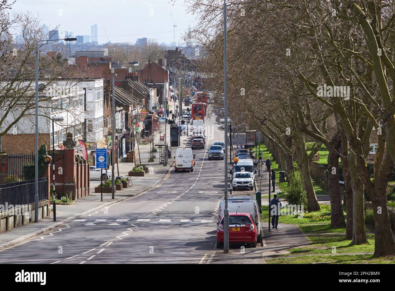Old Church Road, Chingford, London UK, looking south towards Chingford Mount, with Canary Wharf buildings in the far distance Stock Photo