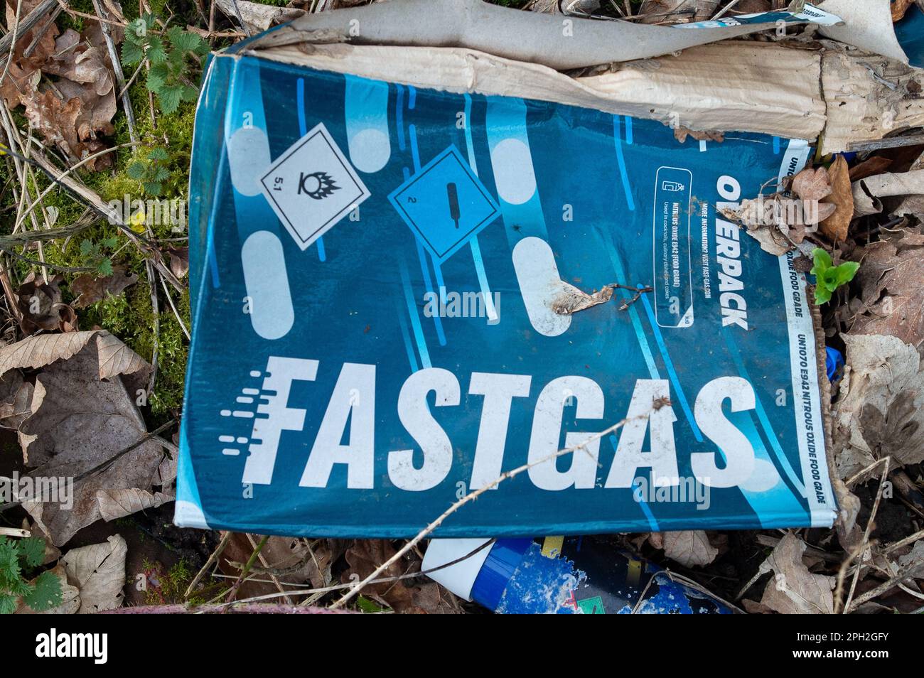 Hythe End, UK. 25th March, 2023. Fastgas Nitrous Oxide Cream Chargers abandoned next to the side of the road. The Government are to ban the use or possession of nitrous oxide known as laughing gas in public from next week. Nitrous Oxide also known as hippy crack is used in catering, however, it has become very popular with some young people as a recreational drug and can cause death when it is inhaled. Credit: Maureen McLean/Alamy Live News Stock Photo