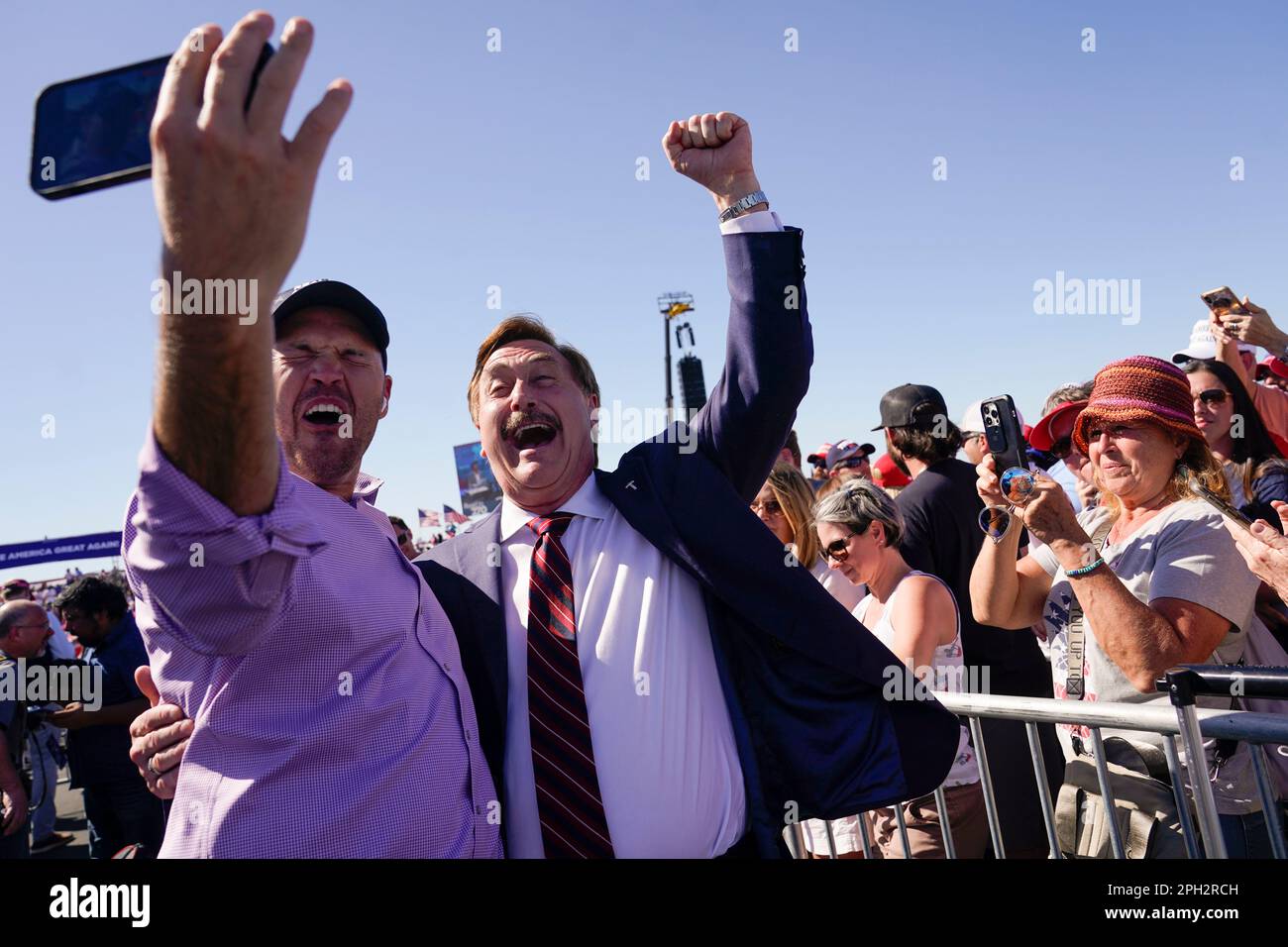 My Pillow CEO Mike Lindell takes a photo with a supporter before former