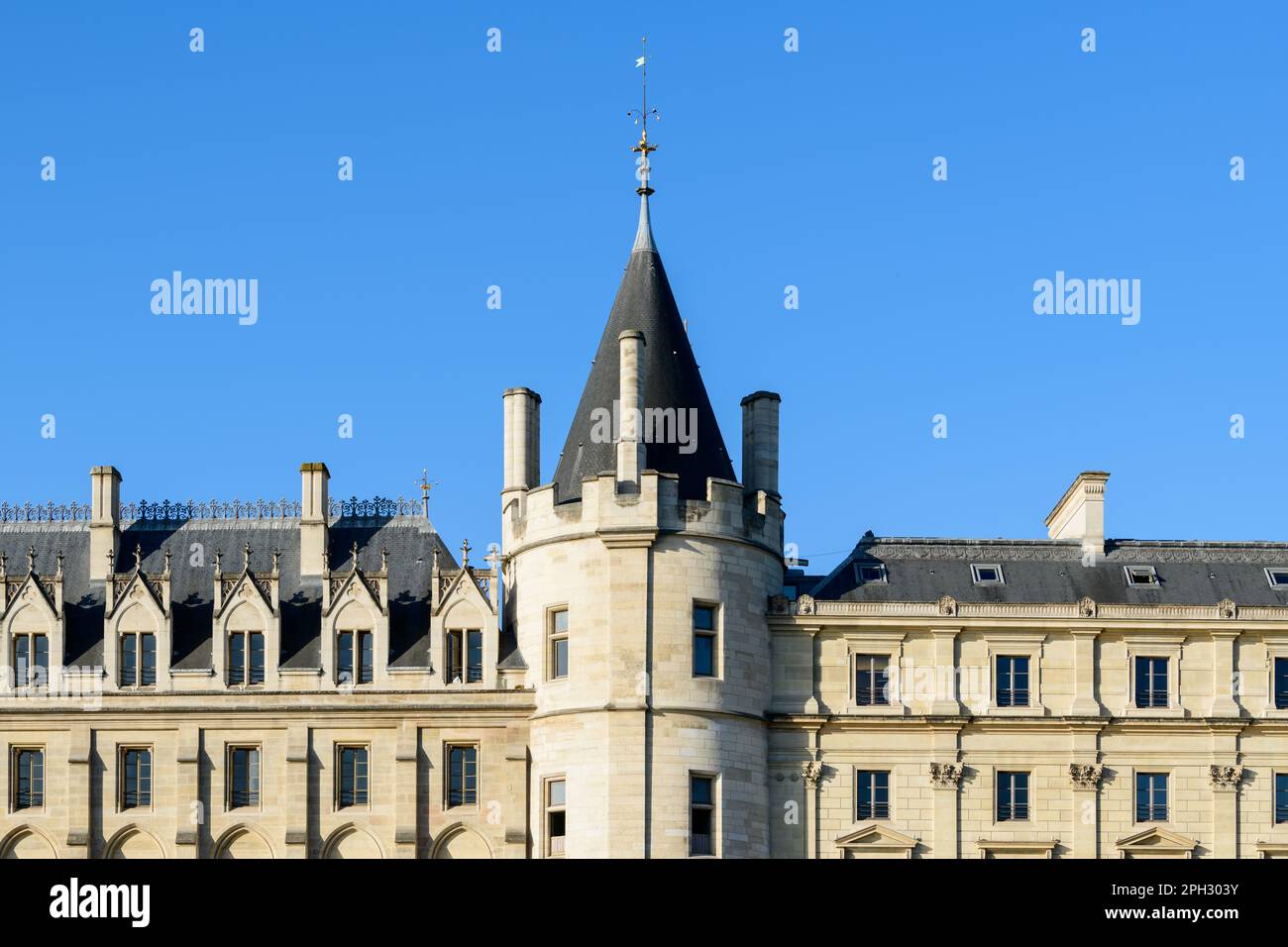 This landscape photo was taken, in Europe, in France, in ile de France, in Paris, on the banks of the Seine, in summer. We see La Conciergerie on the Stock Photo