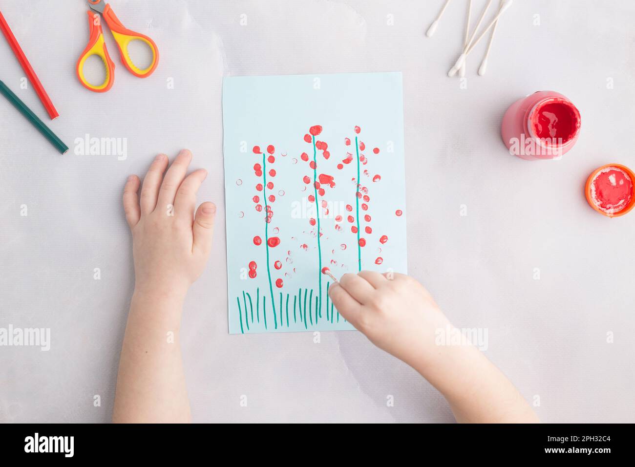 simple kids paper craft painting flowers with cotton buds Stock Photo