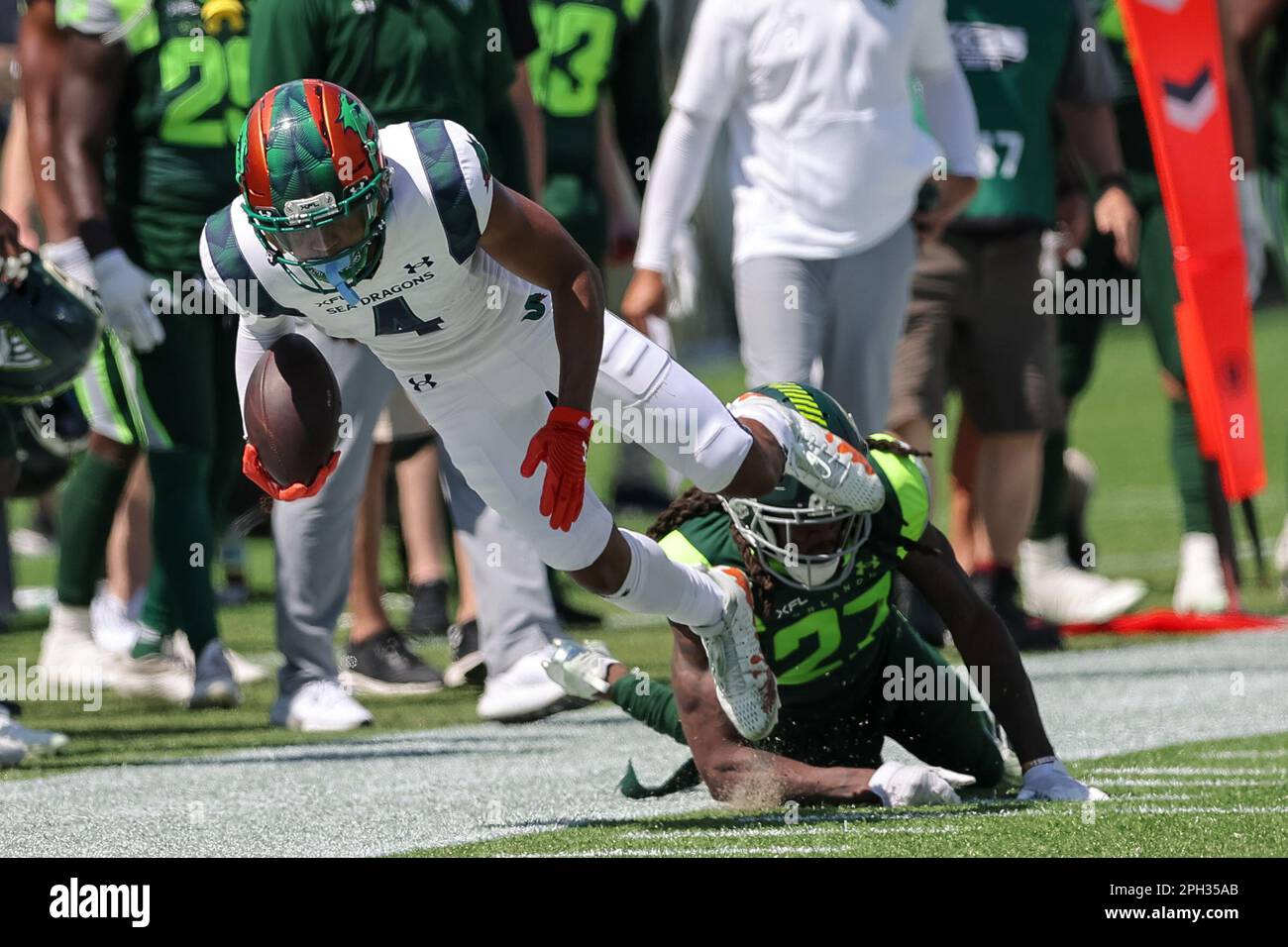 March 25, 2023: Seattle Sea Dragons wide receiver JUWAN GREEN (4) get  tackled during the Orlando Guardians vs Seattle Sea Dragons XFL game at  Camping World Stadium in Orlando, Fl on March