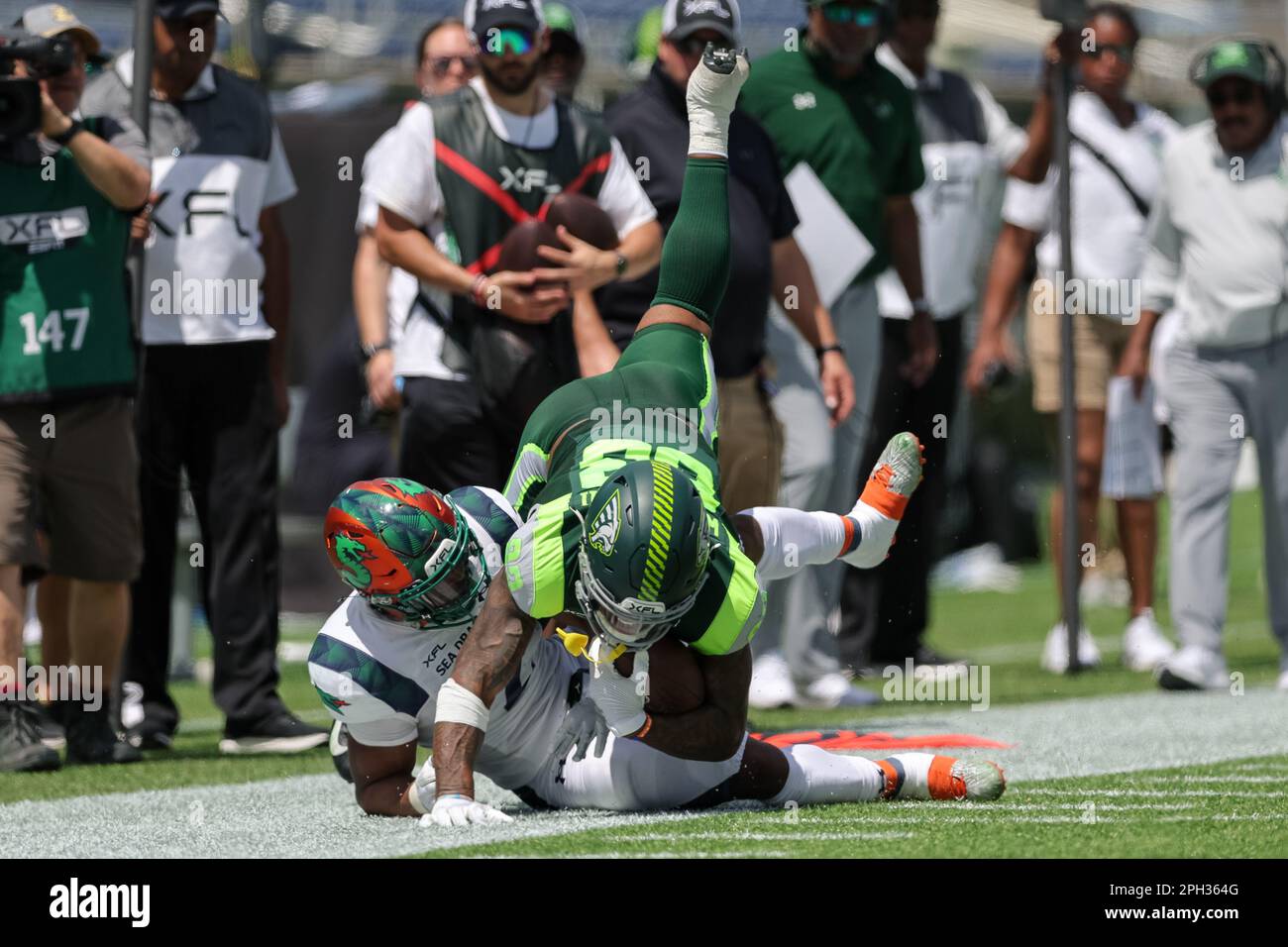 March 25, 2023: Seattle Sea Dragons wide receiver JUWAN GREEN (4) get  tackled during the Orlando Guardians vs Seattle Sea Dragons XFL game at  Camping World Stadium in Orlando, Fl on March