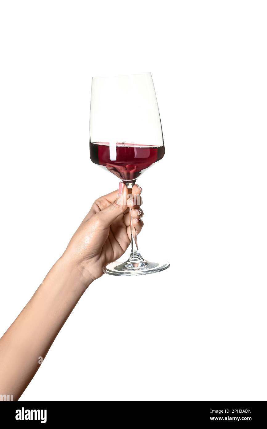 Female hand holding glass of red wine isolated on white background ...
