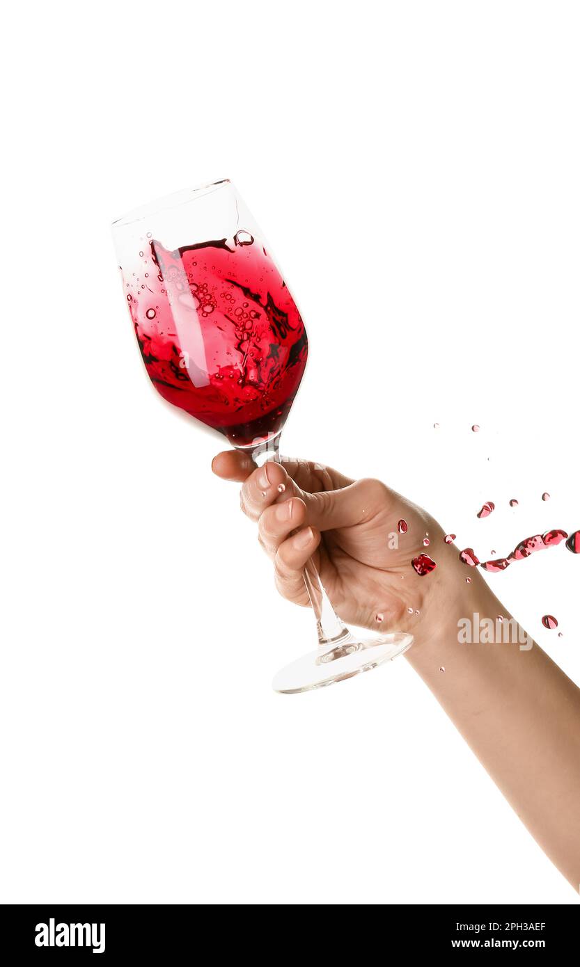 Female hand holding glass of red wine isolated on white background ...