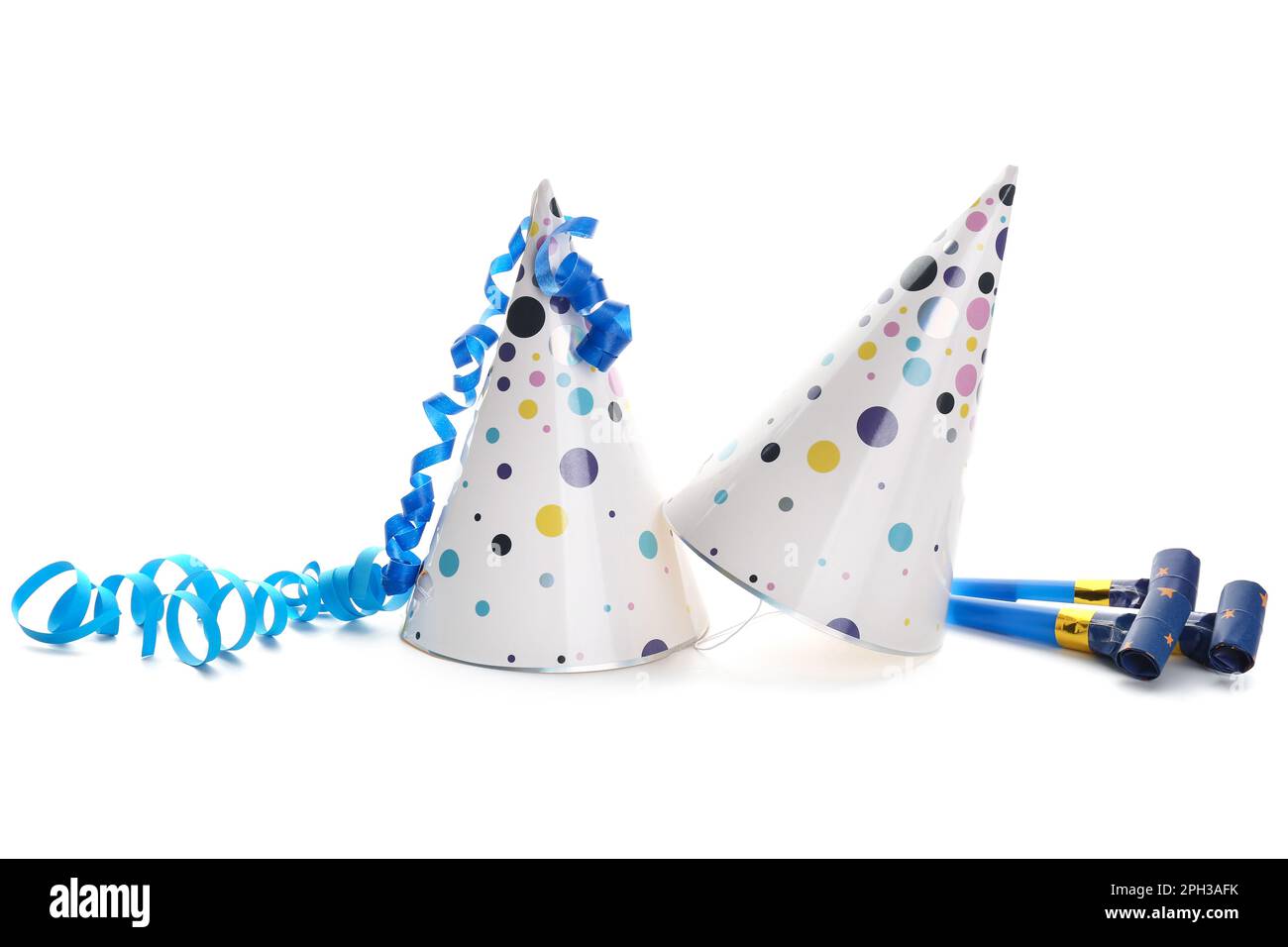 Party hats with serpentine and whistles on white background Stock Photo ...