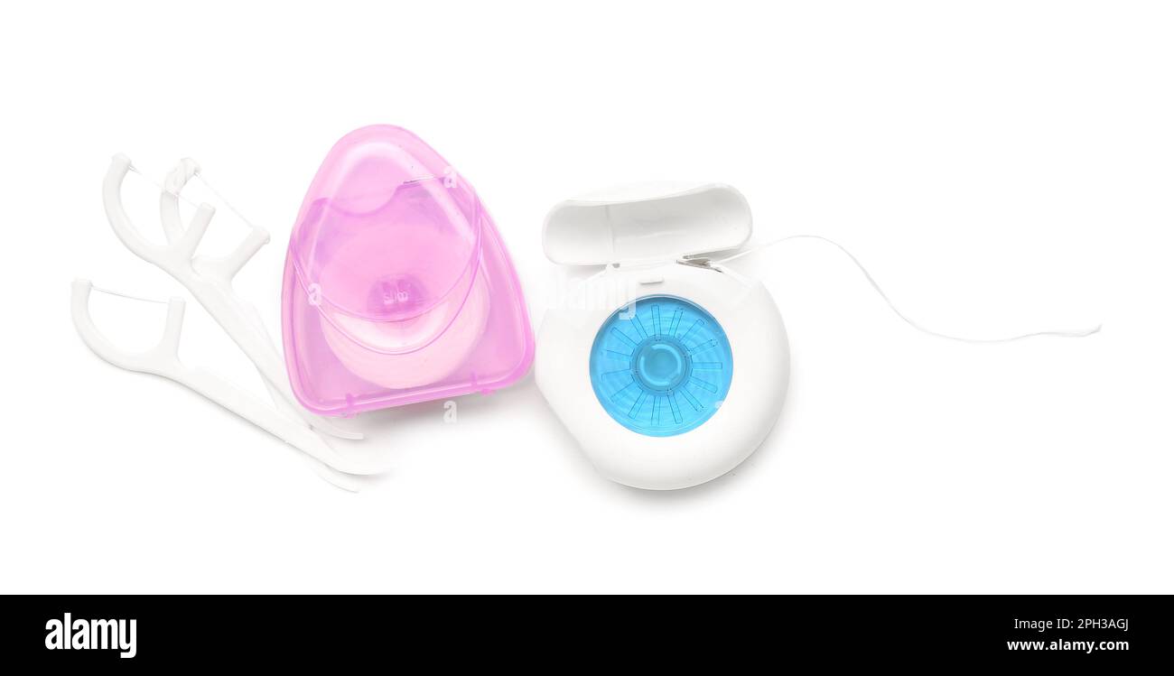 Different cases with dental floss isolated on white background Stock