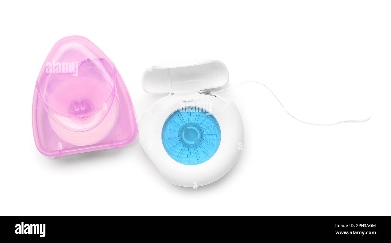 Different cases with dental floss isolated on white background Stock