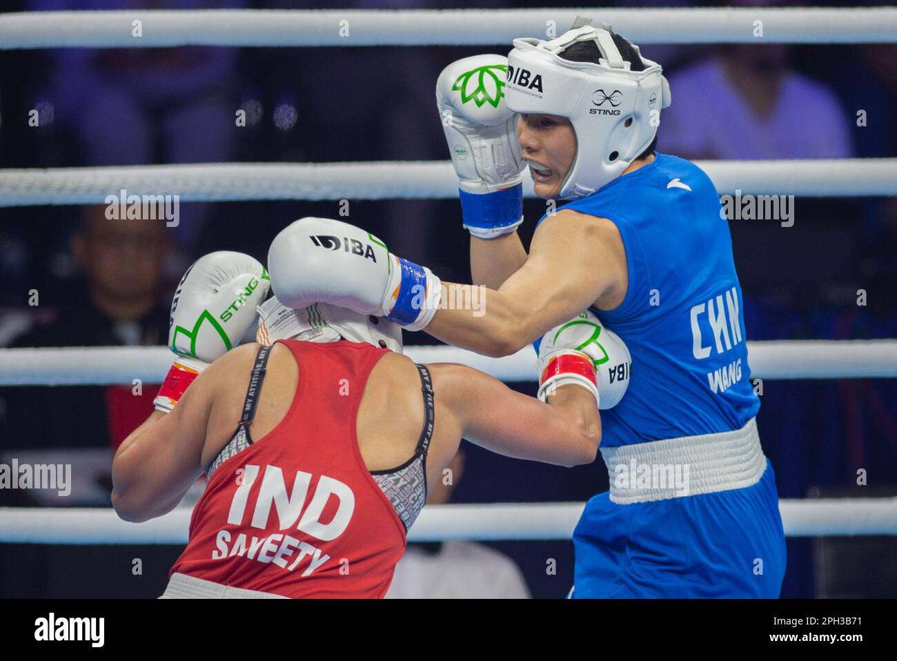 New Delhi, India. 25th Mar, 2023. Wang Lina (R) of China competes with ...