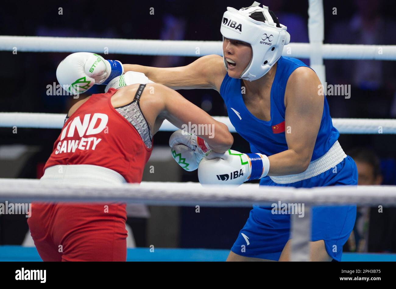 New Delhi, India. 25th Mar, 2023. Wang Lina (R) of China competes with ...