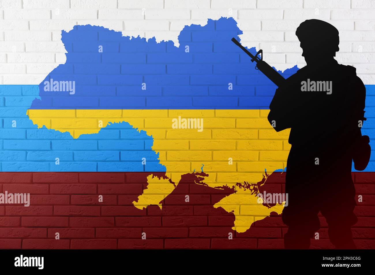 Russian-Ukrainian war. Silhouette of soldier against brick wall with outline map of Ukraine and Russian flag Stock Photo
