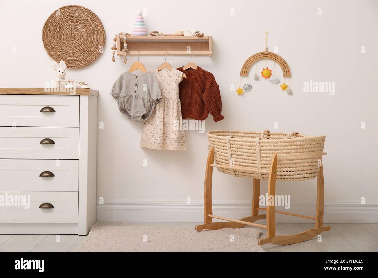 Nursery interior with stylish furniture, clothes and accessories Stock ...