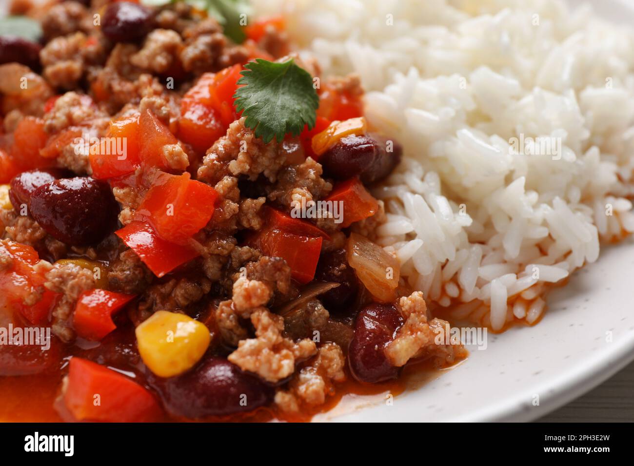 Plate of rice with chili con carne, closeup view Stock Photo - Alamy