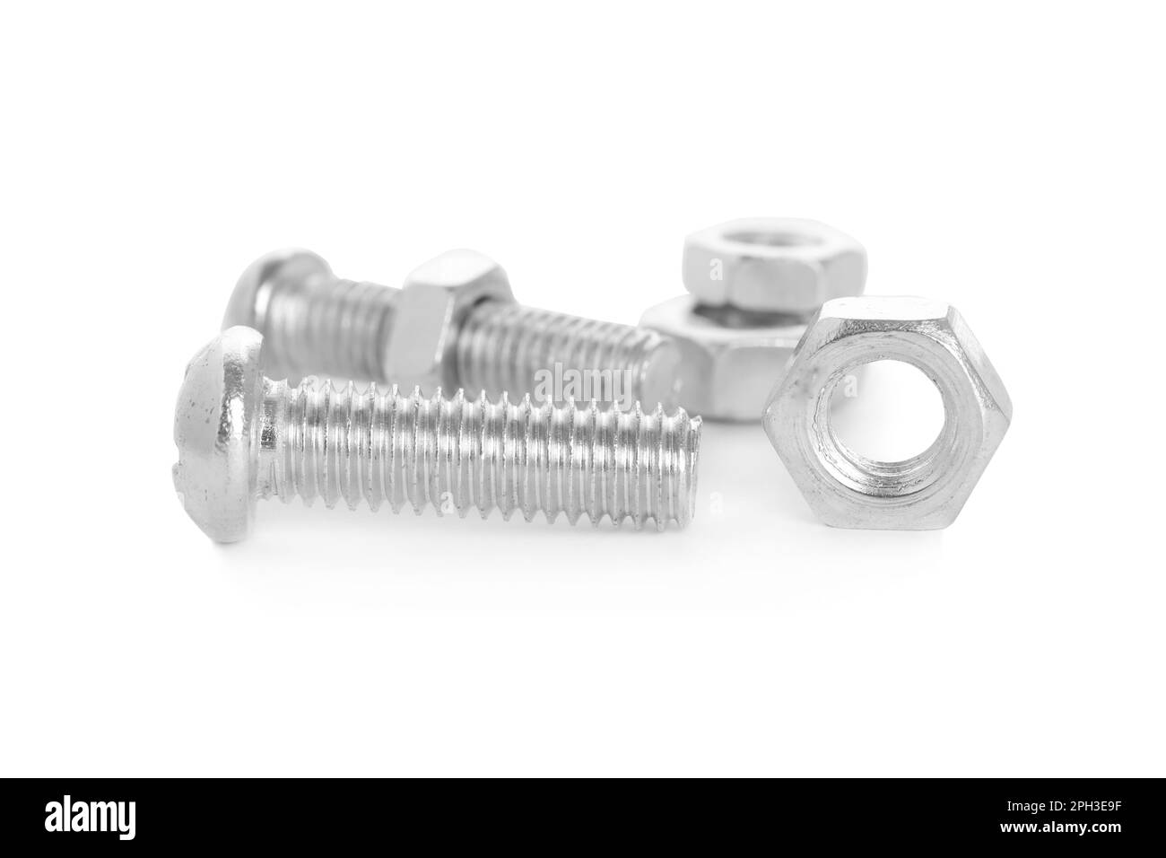 Metal bolts and hex nuts on white background Stock Photo Alamy