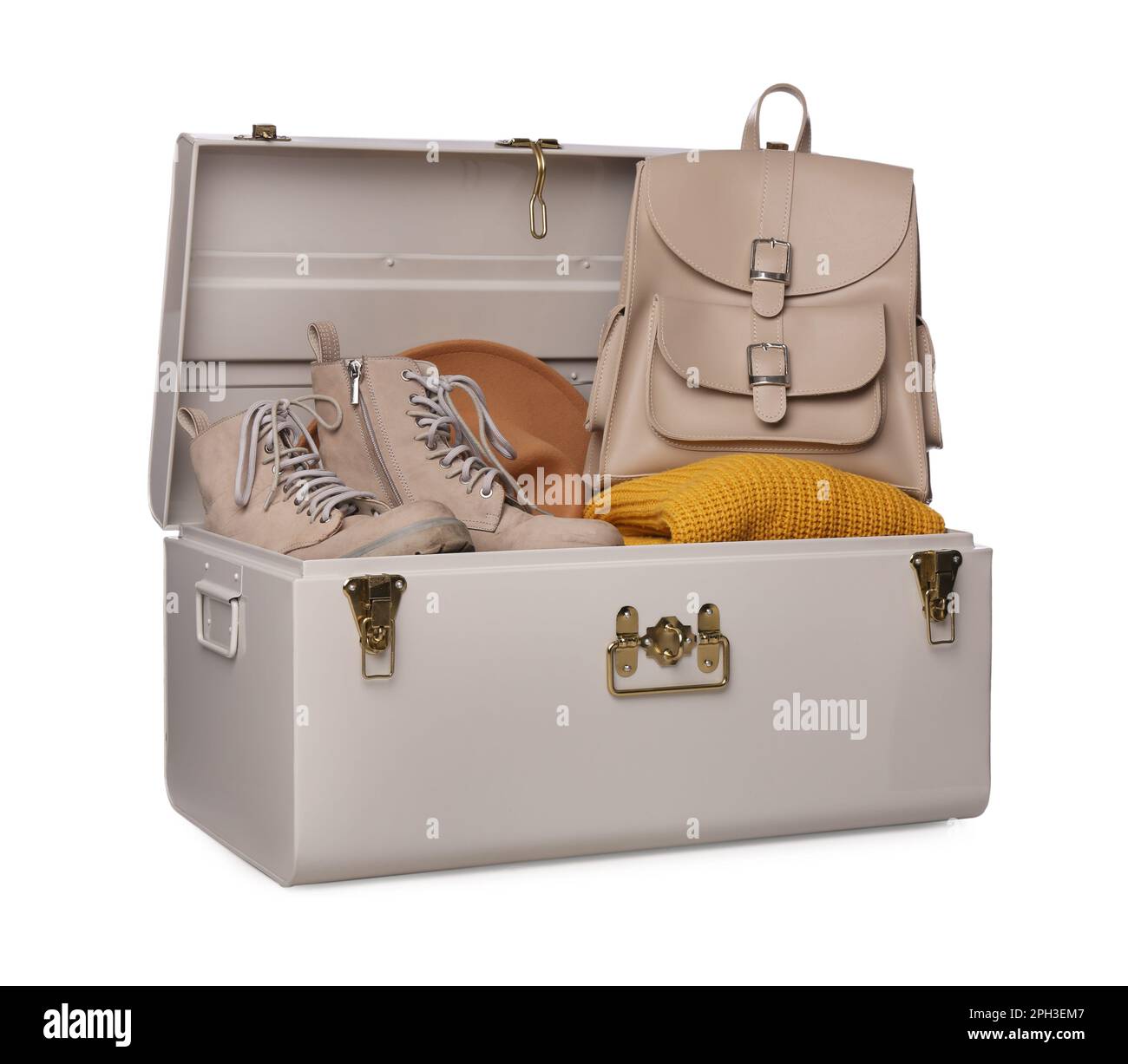 Stylish storage trunk with shoes, clothes and backpack isolated on