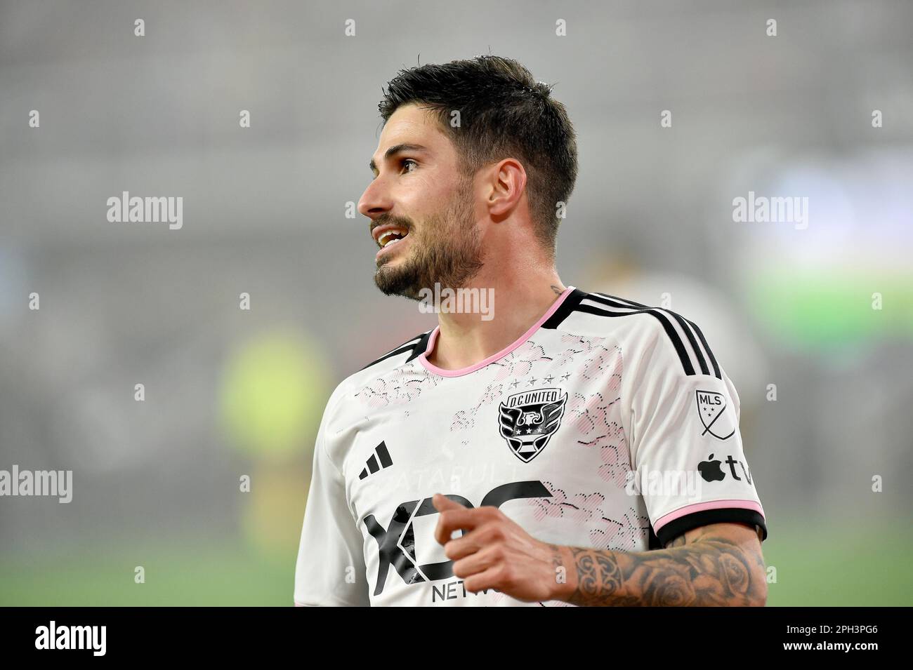 WASHINGTON, DC - MARCH 25: DC United midfielder Taxiarchis Taxi Fountas  (11) reacts while wearing the D.C. United Cherry Blossom Kit Jersey during  the New England Revolution versus D.C. United Major League