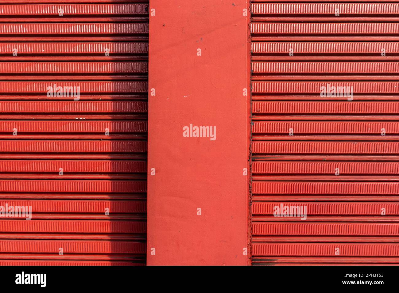 texture pattern of iron door of closed store and rough wall in Brazil
