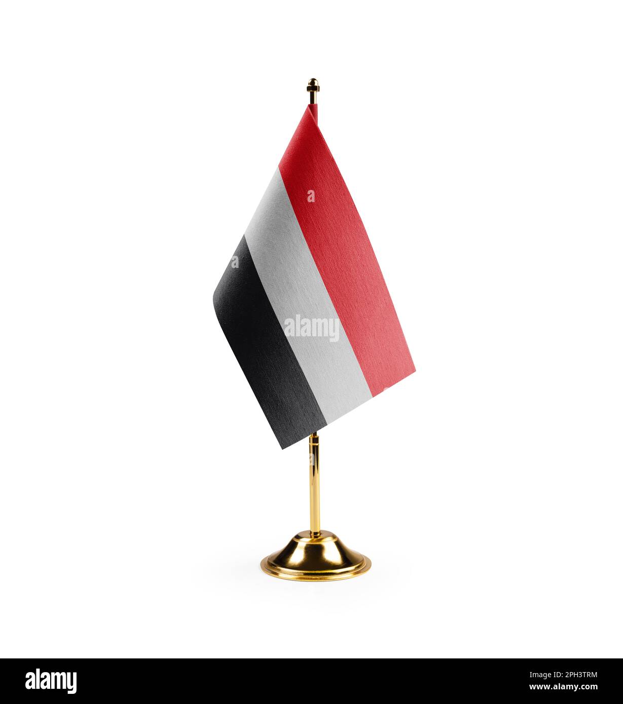 Small national flag of the Yemen on a white background. Stock Photo