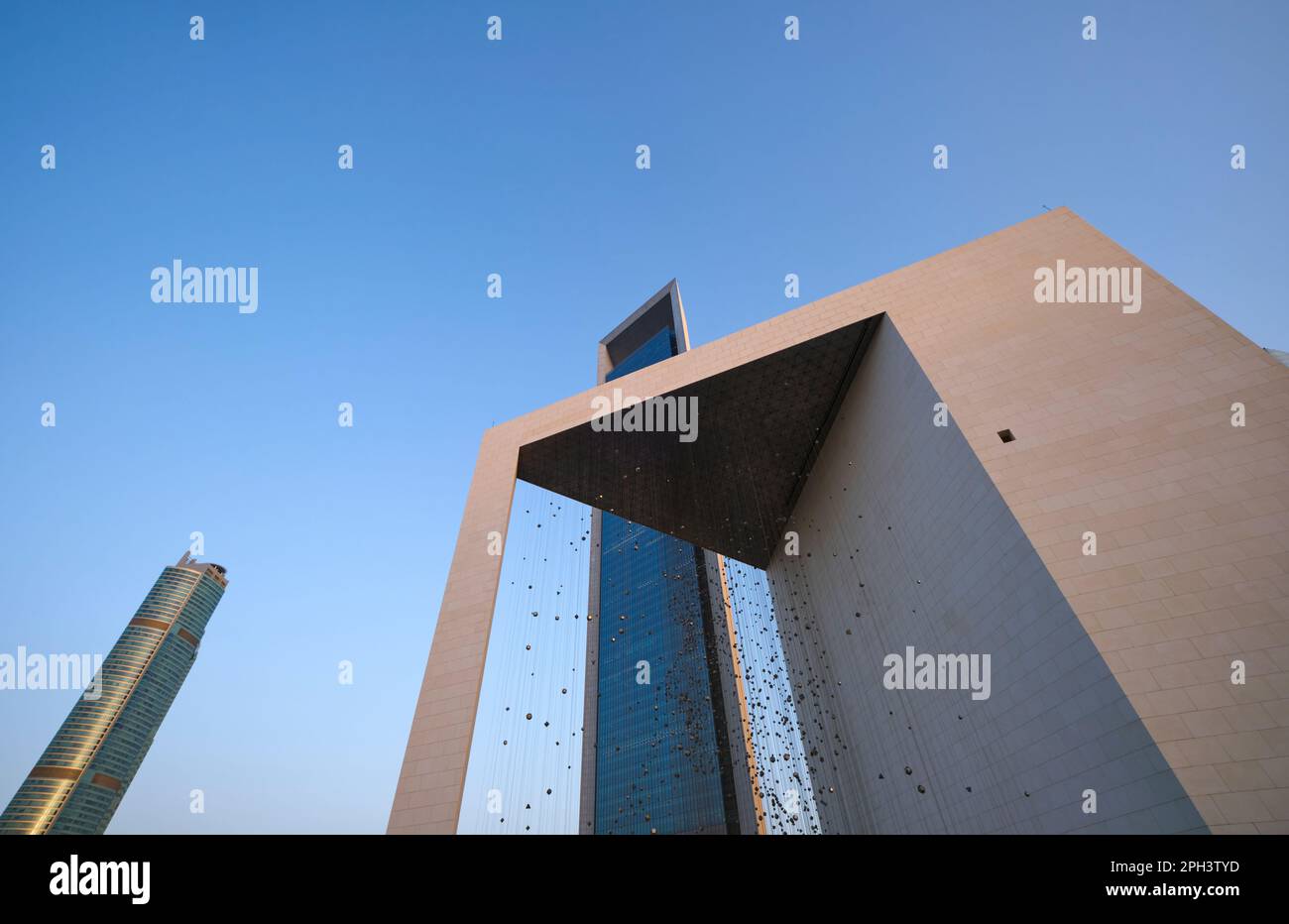 View of the Founder's Memorial, monument, dedicated to Sheikh Zayed bin Sultan. The ADNOC headquarters tower in the background. In Abu Dhabi, UAE, Uni Stock Photo