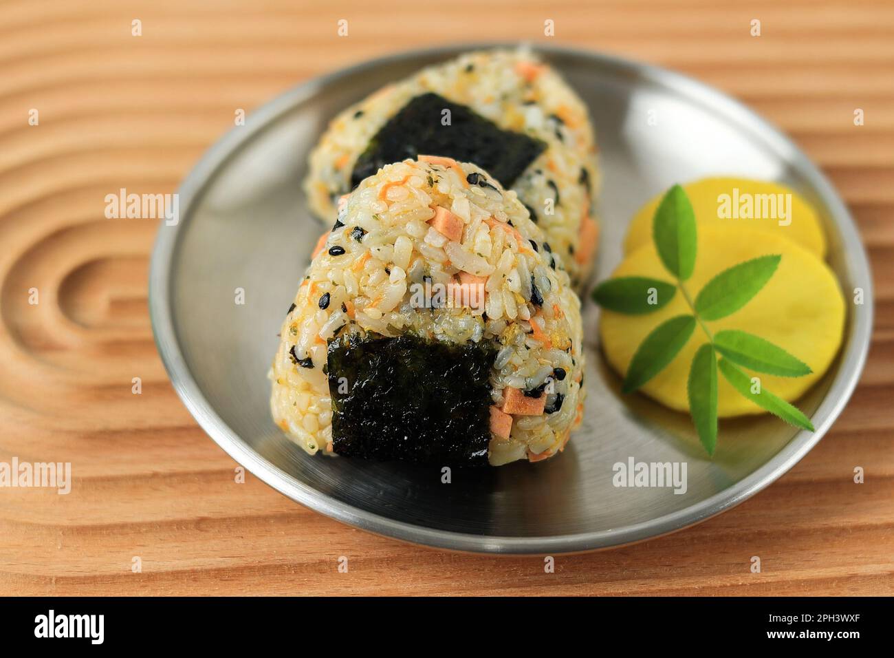 Close Up Triangle Onigiri with Sesame Seed, Sausage, Nori, and Ham