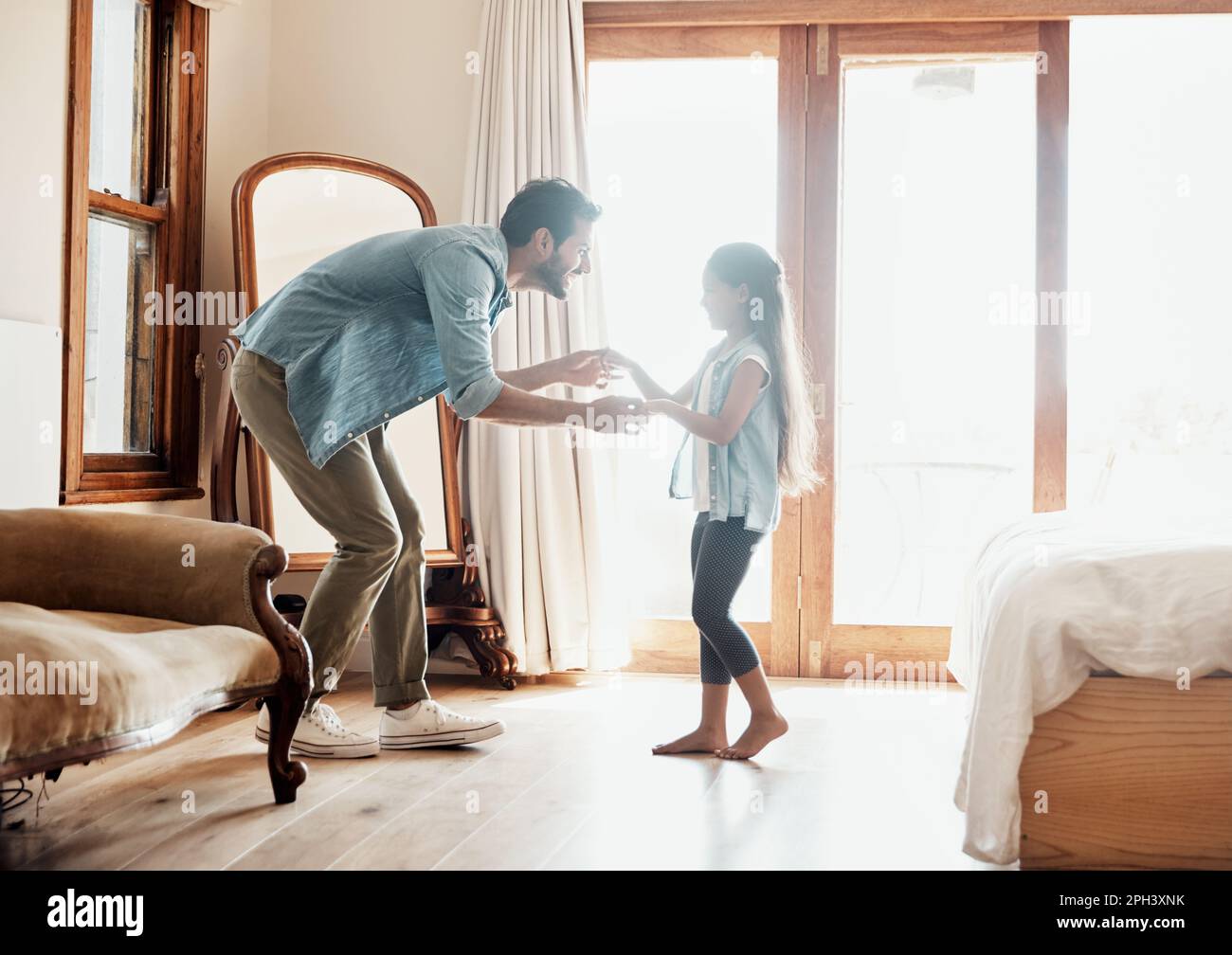Moving and grooving with daddy. a happy father and daughter dancing