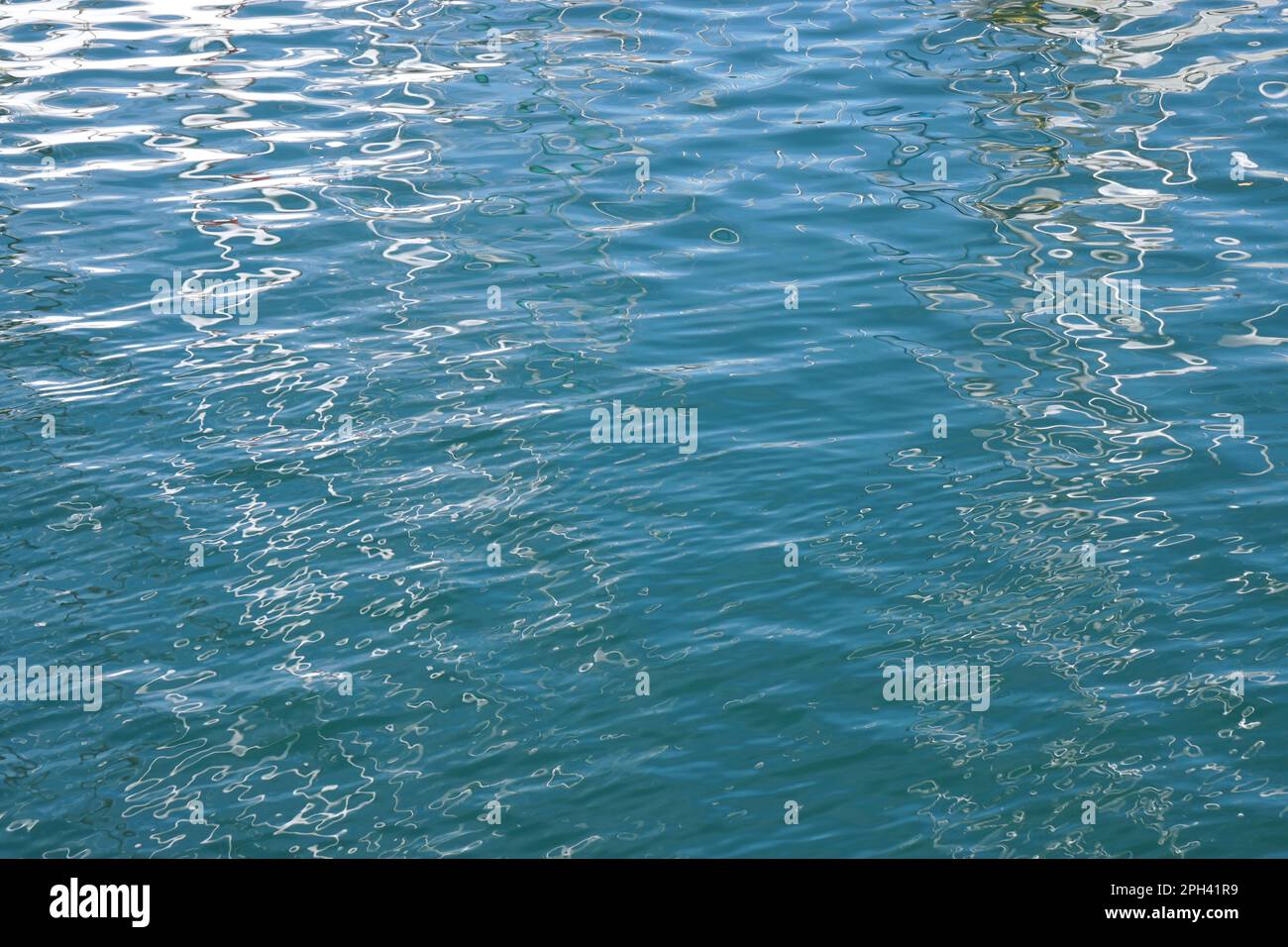 calm sea background, blue water surface with gentle waves and ...