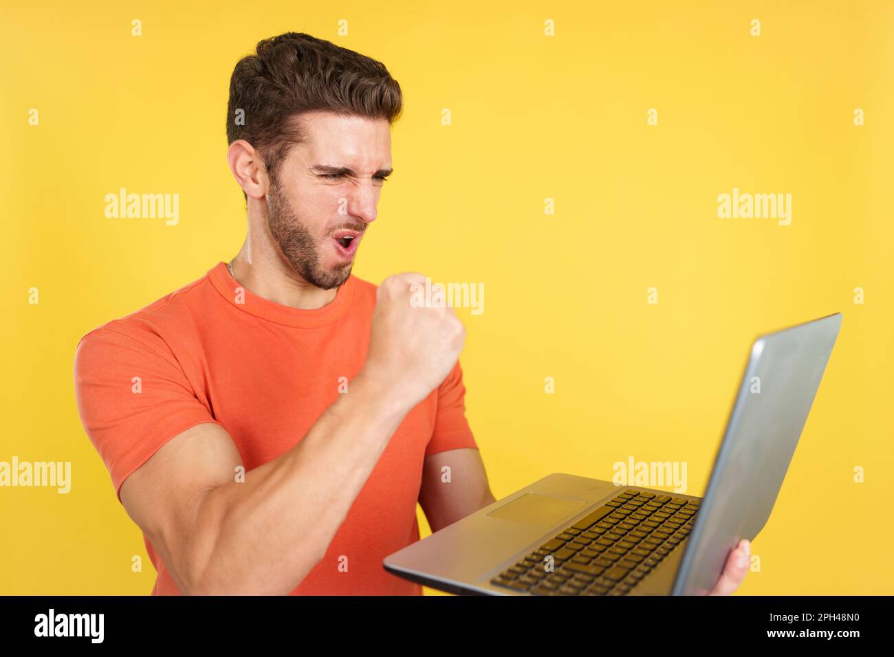 Young adult man celebrating online hi-res stock photography and images ...