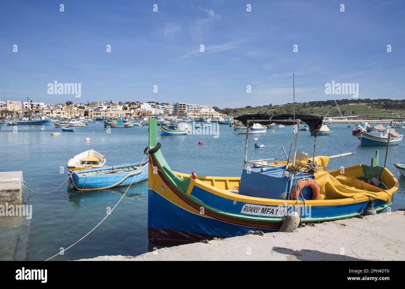 multi coloured boats in the traditional fishing village of marsaxlokk ...