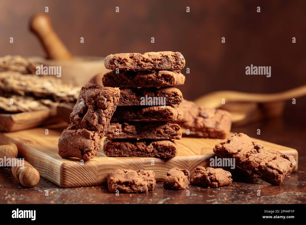 Pieces of fresh brownie with mint on an old table with kitchen utensils