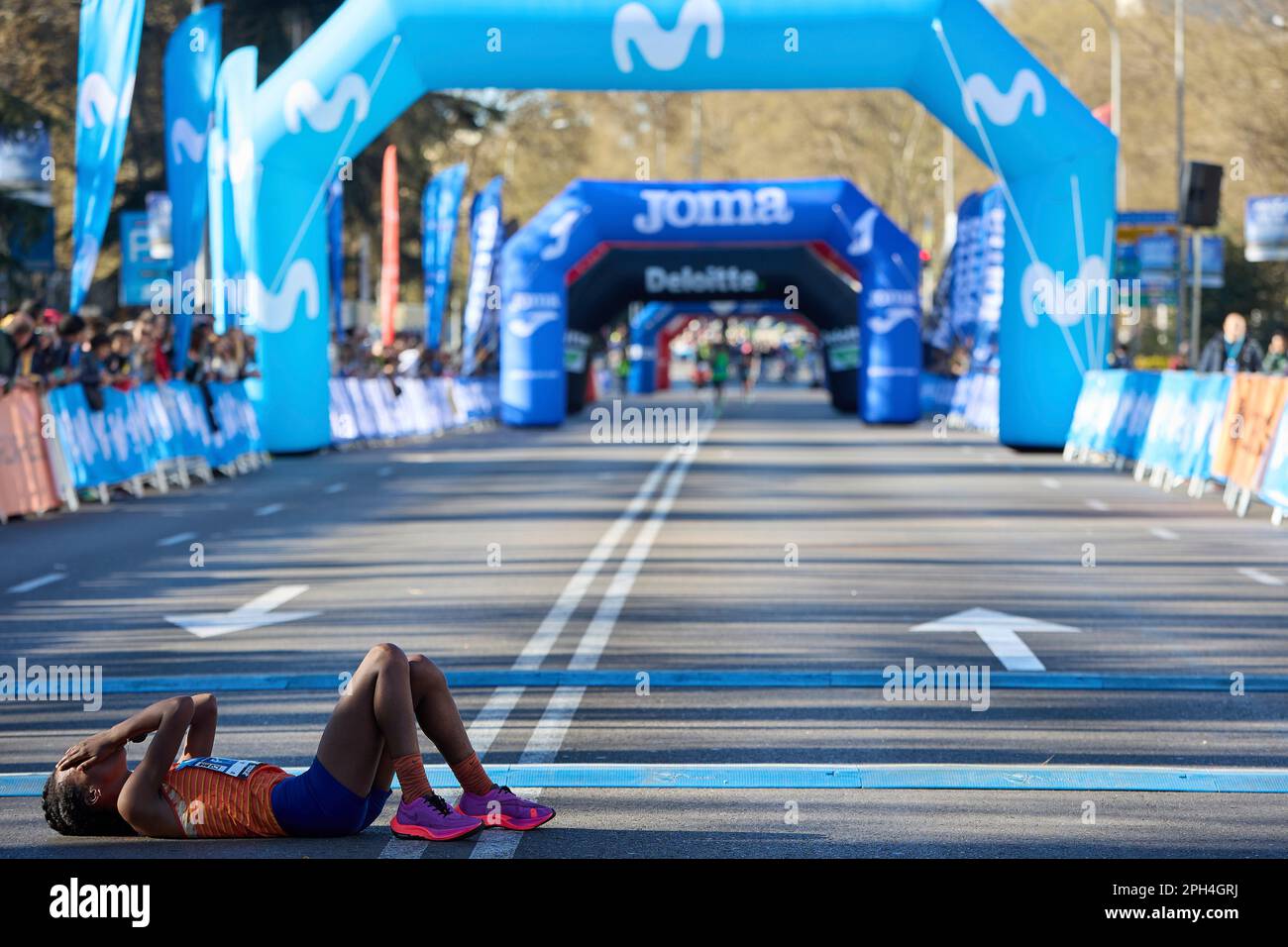 The winning female athlete, Zewditu Aderaw Gelaw, rests after reaching