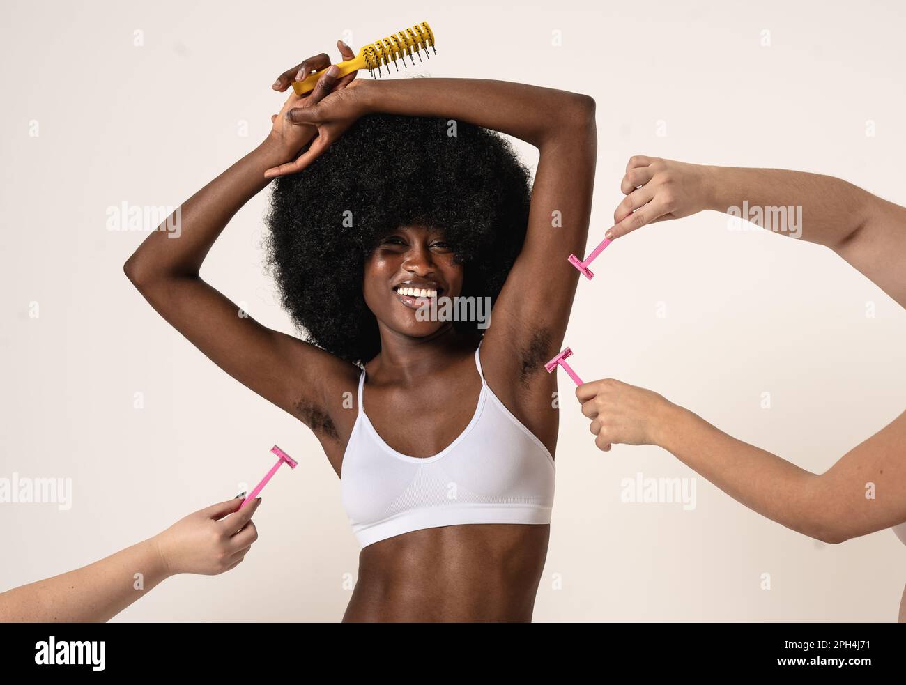 Celebrating Natural Beauty - Young  woman confidently shows off her hairy armpits as a symbol of self-acceptance and defiance against societal beauty Stock Photo