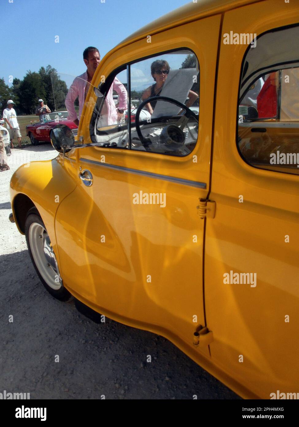 Le Bourget du lac, France - August 19th 2012 : Public exhibition of classic cars. Interior of a yellow Renault 4CV grand luxe. Stock Photo