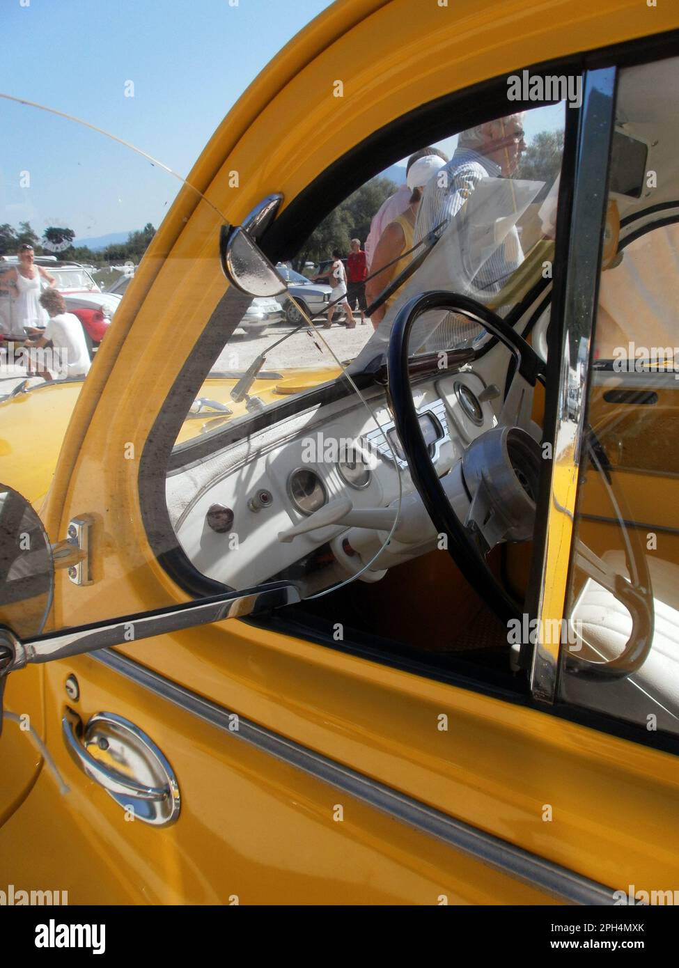 Le Bourget du lac, France - August 19th 2012 : Public exhibition of classic cars. Interior of a yellow Renault 4CV grand luxe. Stock Photo