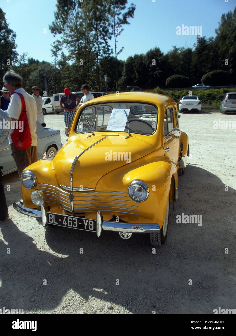 Le Bourget du lac, France - August 19th 2012 : Public exhibition of classic cars. Focus on a yellow Renault 4CV grand luxe. Stock Photo