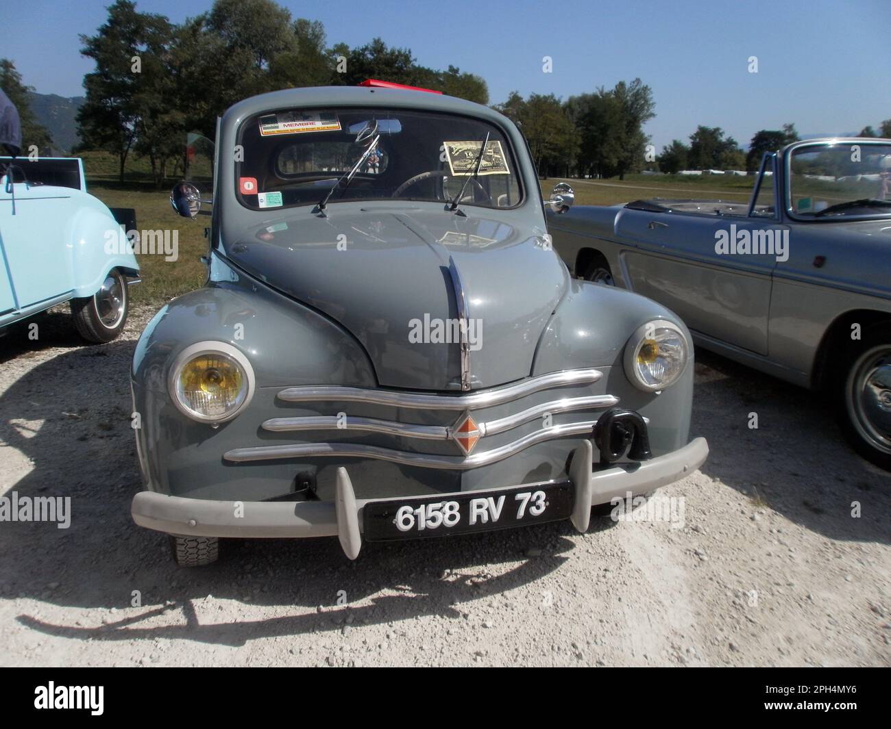 Le Bourget du lac, France - August 19th 2012 : Public exhibition of classic cars. Focus on a green Renault 4CV. Stock Photo