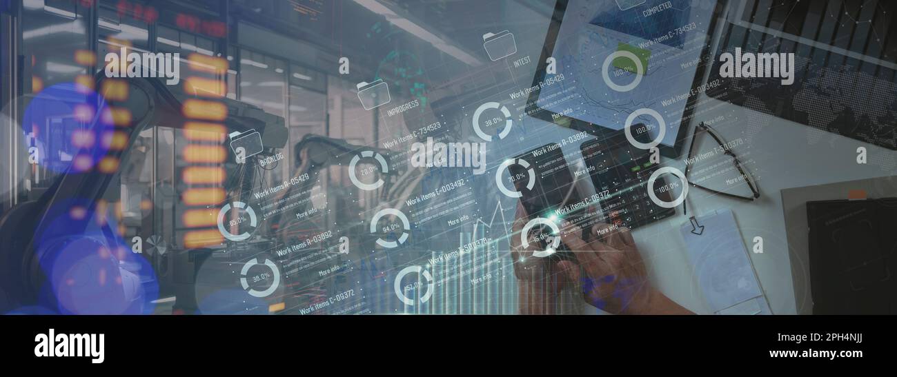 Top view Engineer manager analyzing and control automation robot arms machine on software modern virtual interface data real time in intelligent facto Stock Photo