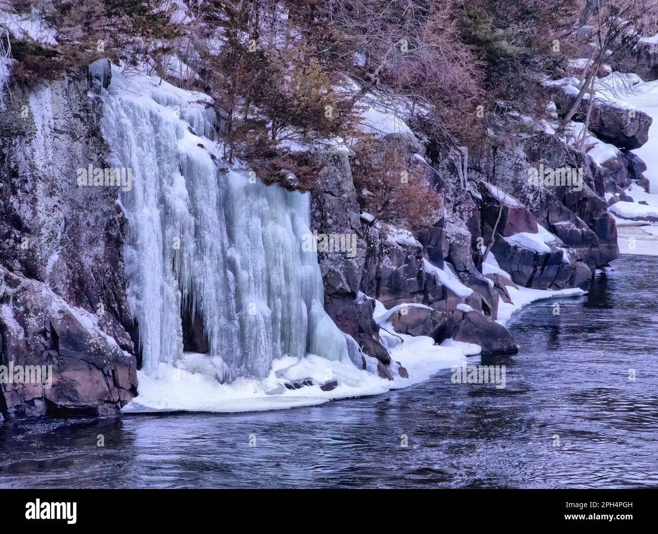 Frozen waterfall over the rocks at Interstate State Park in St. Croix