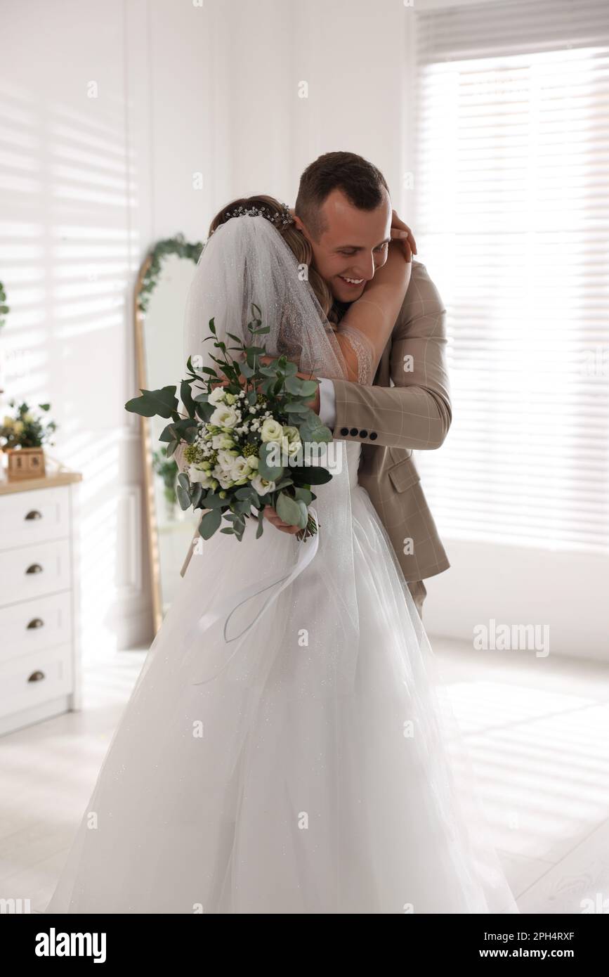 Wedding couple indoors hugging hi-res stock photography and images - Alamy