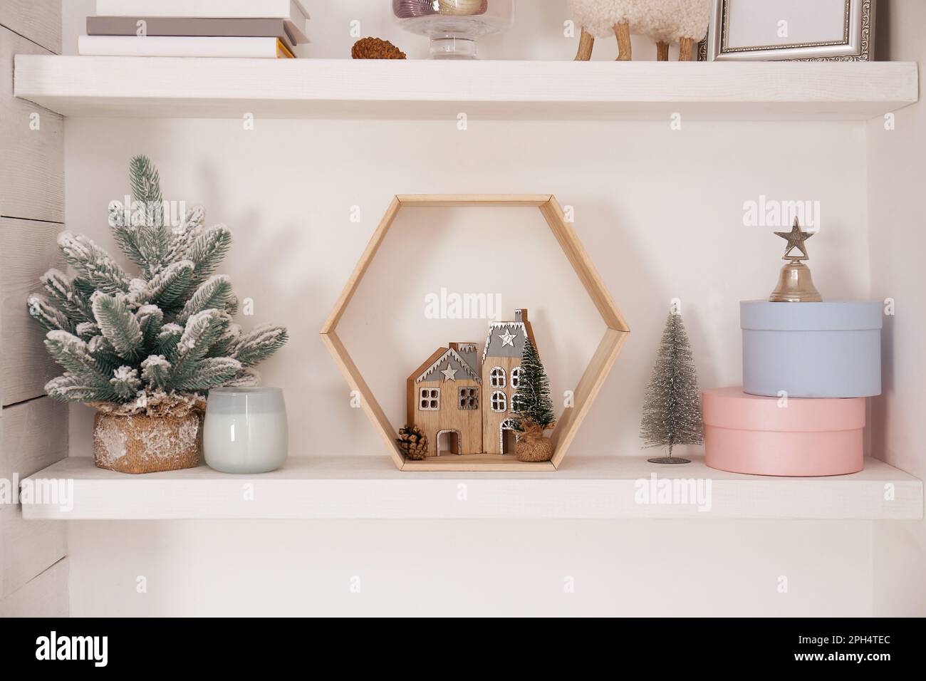 Wall shelves with beautiful Christmas decor indoors. Interior design ...