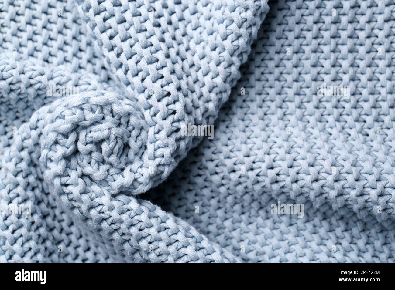 Beautiful light blue knitted fabric as background, top view Stock Photo ...
