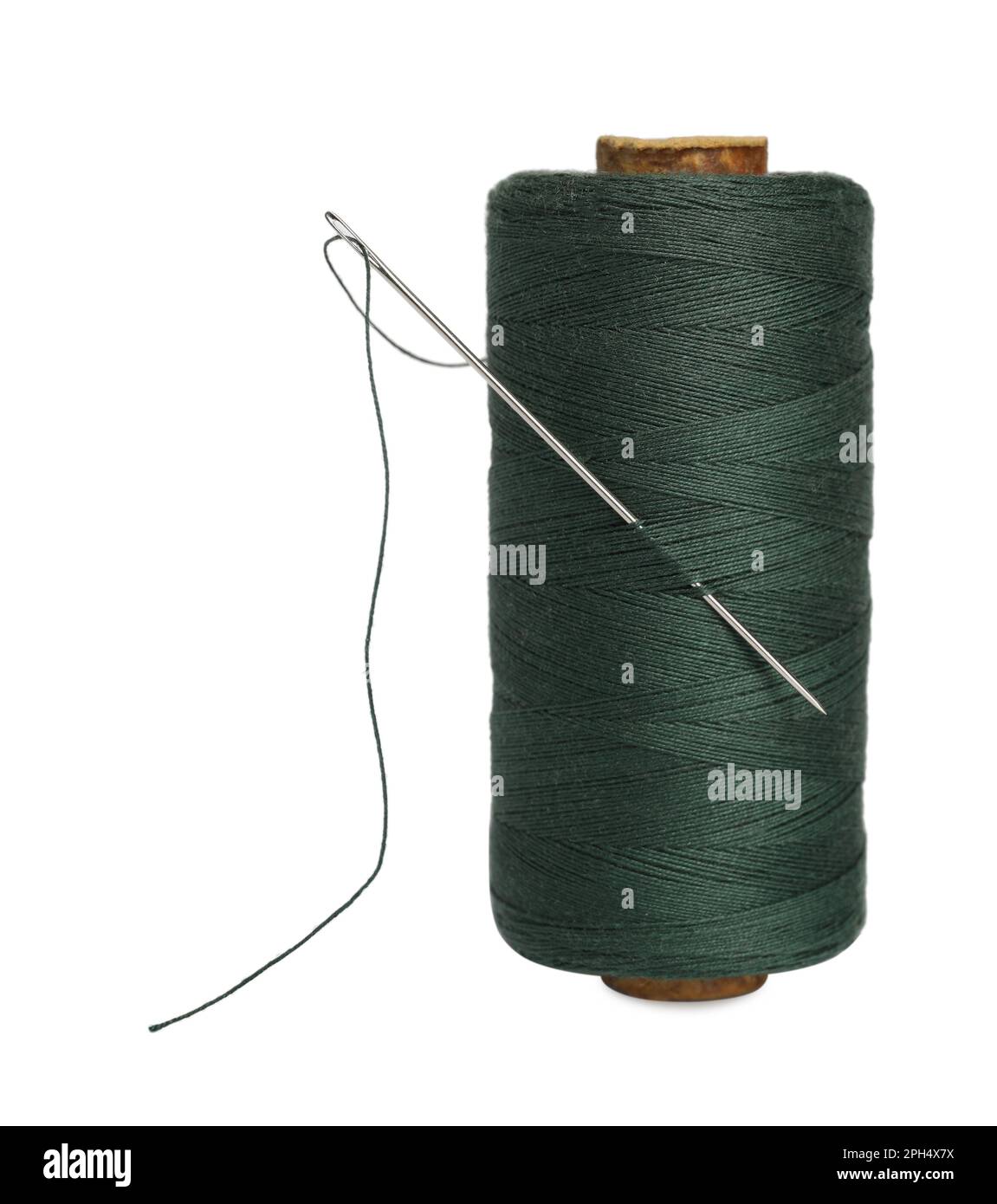 Green sewing thread with needle on white background Stock Photo Alamy