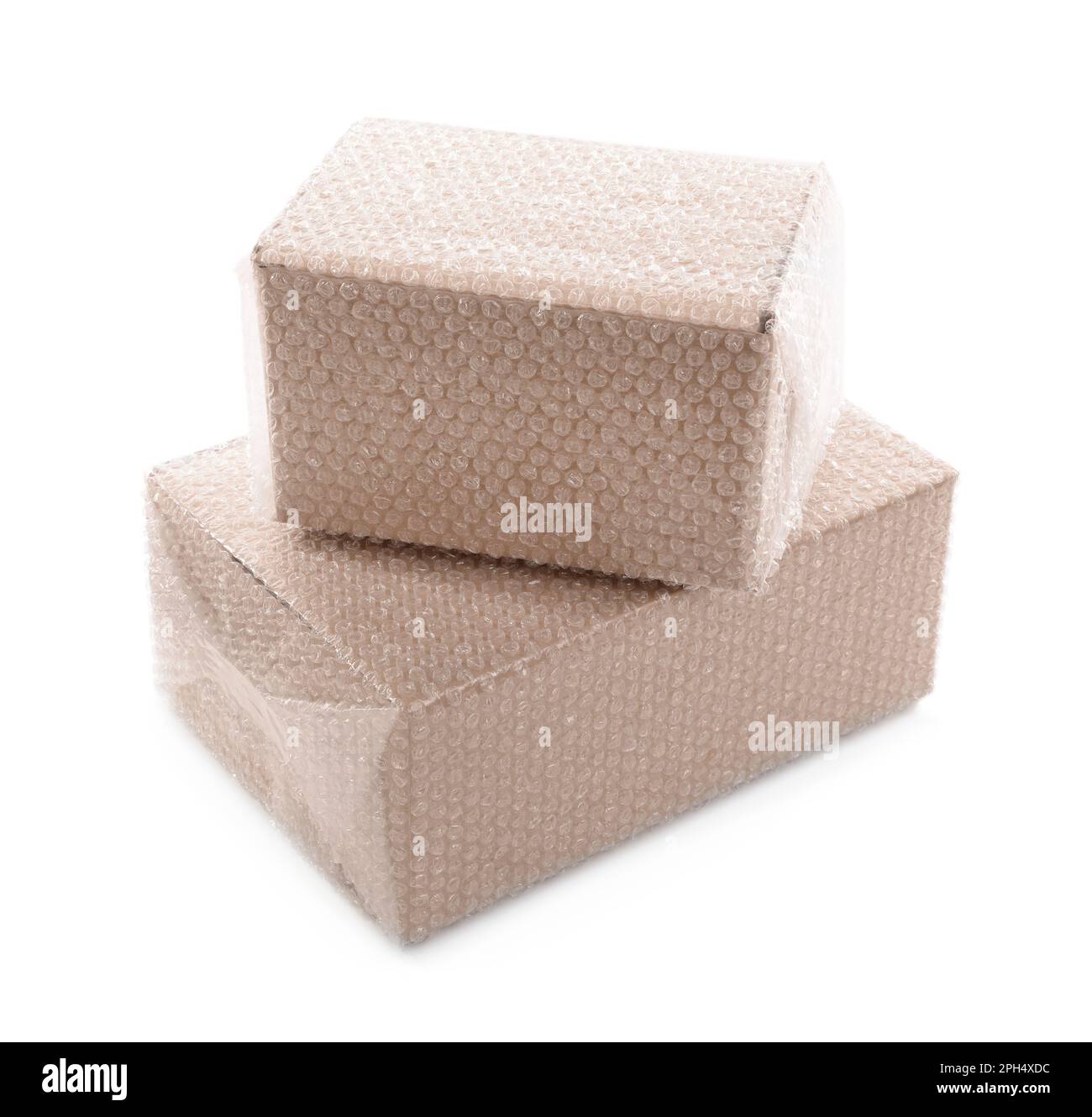 Cardboard boxes packed in bubble wrap on white background Stock Photo