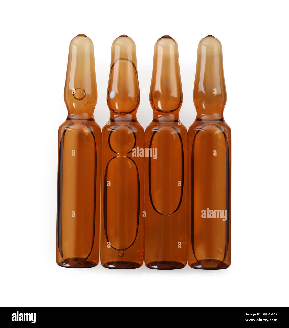 Glass ampoules with pharmaceutical product on white background, top