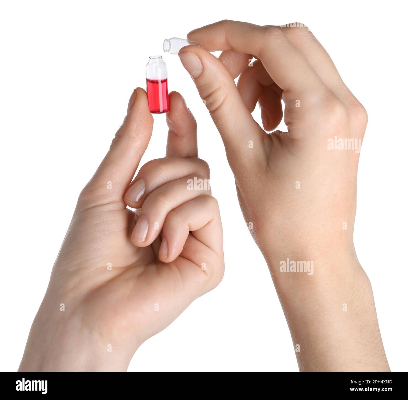 Woman opening glass ampoule with pharmaceutical product on white