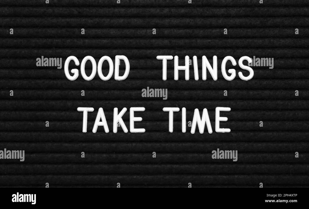 Black letter board with motivational quote Good Things Take Time, closeup view Stock Photo