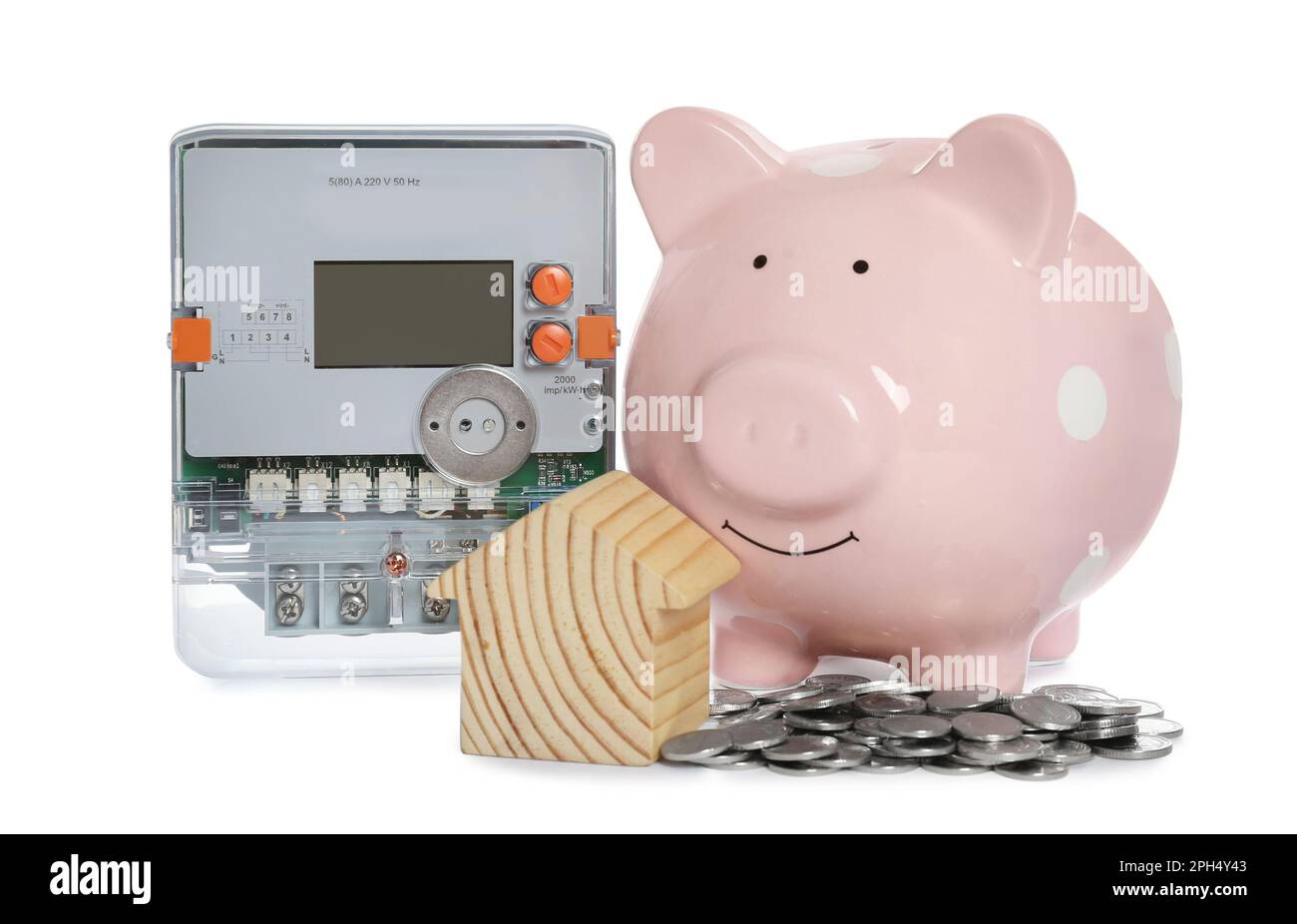 Electricity meter, house model, piggy bank and coins on white ...
