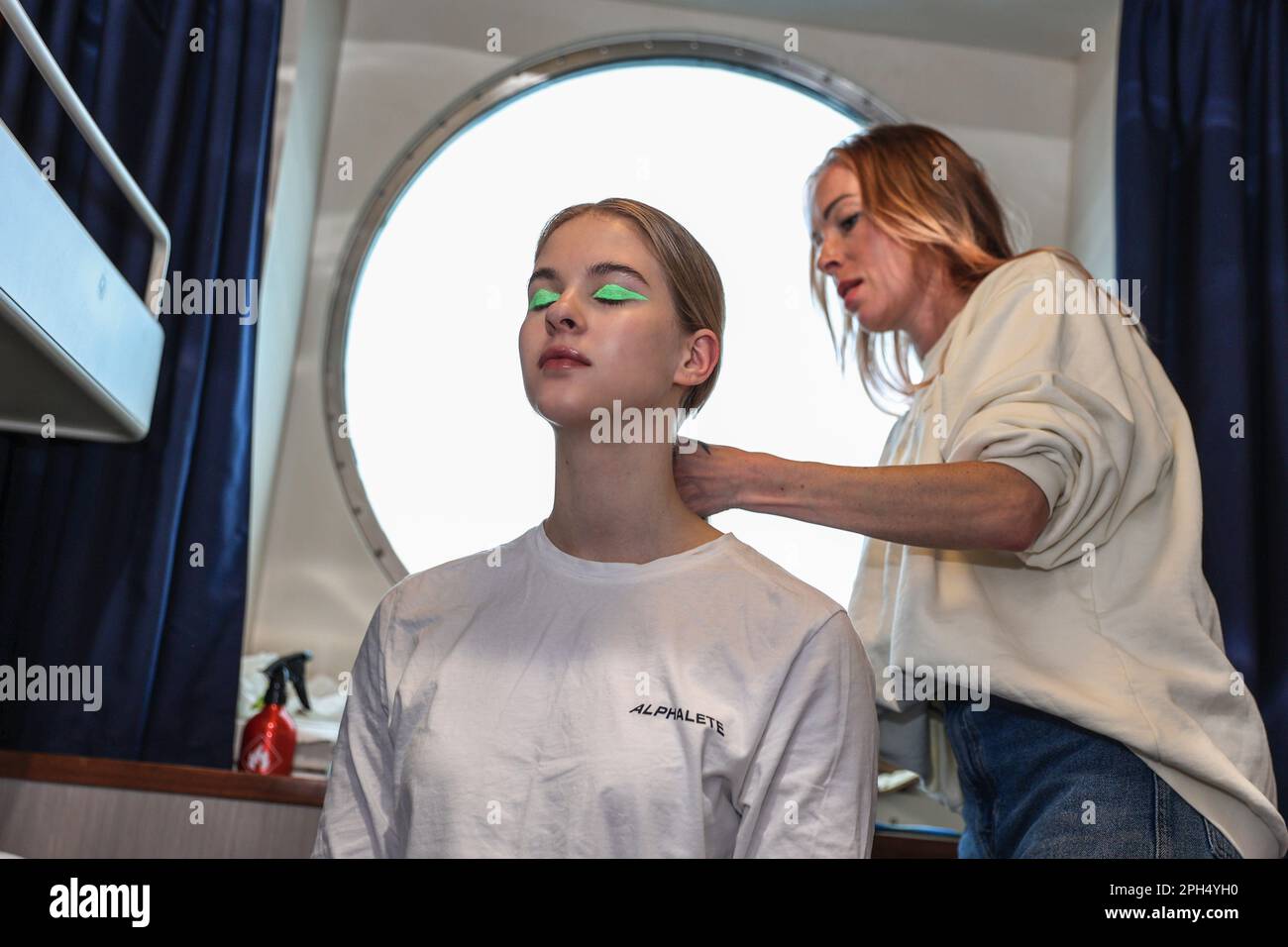 Helsinki, Finland. 24th Mar, 2023. Makeup artist stylist preparing model for fashion show. 26th March 2023 Eckero Line ship company organized Fashion Festival on the Finlandia ship that runs between Helsinki and Tallinn. The Fashion Festival has been realized in cooperation with Ivana Helsinki, piloted by Paola Suhonen. Credit: SOPA Images Limited/Alamy Live News Stock Photo