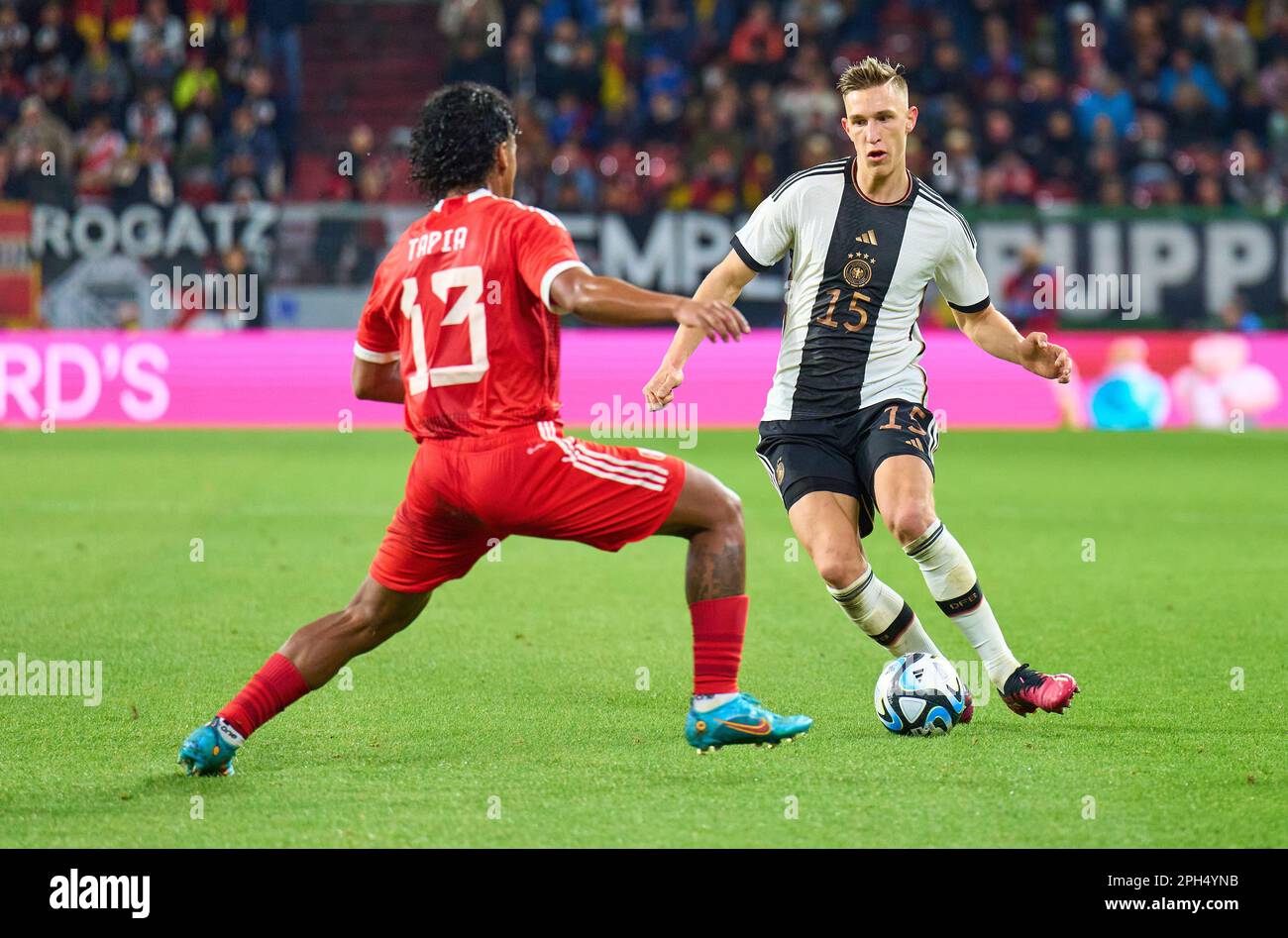 Nico Schlotterbeck, DFB 15  compete for the ball, tackling, duel, header, zweikampf, action, fight against Renato Tapia, Peru 13  in the friendly match GERMANY - PERU 2-0 Preparation for European Championships 2024 in Germany ,Season 2022/2023, on Mar 25, 2023  in Mainz, Germany.  © Peter Schatz / Alamy Live News Stock Photo